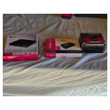 LG Slim Portable DVD Writer GP50, T-Mobile LineLink, and Timex Sinclair 16K RAM Module