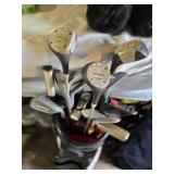 Spalding and Dunlop Golf Club Bags with Various Clubs