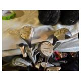 Spalding and Dunlop Golf Club Bags with Various Clubs