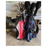 Spalding and Dunlop Golf Club Bags with Various Clubs