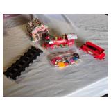Rudolph Train Set and Accessories including Track, Figures, and Gingerbread House - Untested