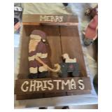 Christmas-themed decorations including Santa signs and candle holder, plus holiday decor items