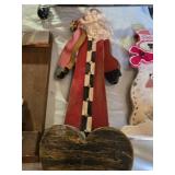 Christmas-themed decorations including Santa signs and candle holder, plus holiday decor items