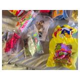 Assorted Vintage Toy Collection Including McGruff Comic Books, Grinch Plush, and Snoopy Toy Set