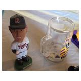 Minnesota Twins Bobblehead, Minnesota Vikings Mug, Goodwrench Service Plus NASCAR Bears, and Vikings Cheerleading Outfit