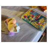 Assorted Vintage Toy Collection Including Flintstones, Dinosaurs, and Puzzle Games