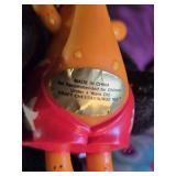 Assorted Vintage Toy Collection Including Flintstones, Dinosaurs, and Puzzle Games