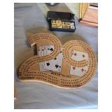 Games including Cribbage Boards, Exploding Kittens Card Game, and AON Safety First Playing Cards