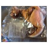 Pastel Plush Bunny, Crocheted Blanket, and Assorted Stuffed Toys