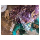 Pastel Plush Bunny, Crocheted Blanket, and Assorted Stuffed Toys