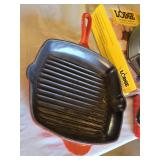 Lodge Cast Iron Grill Pan Set with Red Silicone Handle Holder and Other Cast Iron Grill Pan