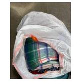 Collection of Quilts and Southwestern Throw Blankets in Storage Tote