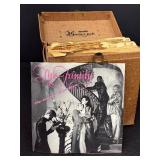 Vintage Vinyl Records Lot in Box - 45 RPM Singles with The Family Album Cover - Varying Wear