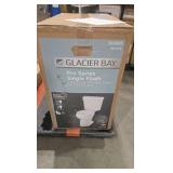 Glacier Bay 12 inch Rough In Two-Piece 1.28 GPF Single Flush Round Toilet in White Seat Included