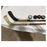 Hockey Sticks and Pucks Lot