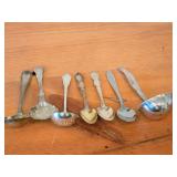Lot of (7) 282-grams (total) Silverplated Flatware - 1847 Rogers Bros Gravy Ladle, Gorham Gravy Ladle, W.M. Rogers Camelot-Melody Fruit Spoons (x2), Sugar Sifter, Decorative Wide Spoon, Decorative Tea