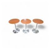 Bernhardt Design Quiet occasional table with a laminate top and a brushed stainless steel base.