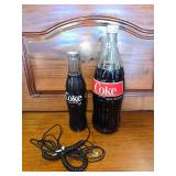 Coke Phone and Giant Coke Bottle with Coke in it.