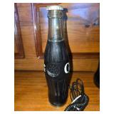 Coke Phone and Giant Coke Bottle with Coke in it.