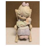 Precious Moments Figurine "Love Never leaves a mother