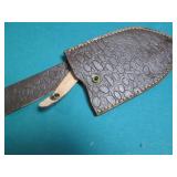 Hand crafted knife with a leather s...