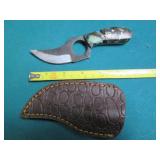 Hand crafted knife with a leather s...