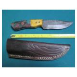 Hand crafted knife with a leather s...