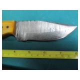 Hand crafted knife with a leather s...