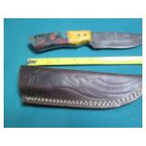 Hand crafted knife with a leather s...