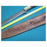 Hand crafted knife with a leather s...
