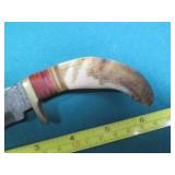 Hand crafted knife with a leather s...