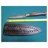 Hand crafted knife with a leather s...