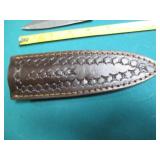 Hand crafted knife with a leather s...