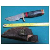 Hand crafted knife with a leather s...