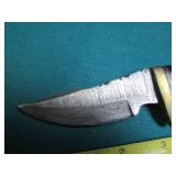 Hand crafted knife with a leather s...