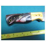 Hand crafted knife with a leather s...