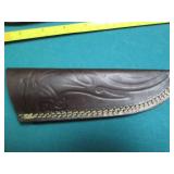 Hand crafted knife with a leather s...
