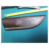 Hand crafted knife with a leather s...