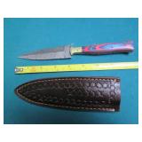 Hand crafted knife with a leather s...