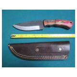 Hand crafted knife with a leather s...