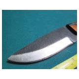 Hand crafted knife with a leather s...