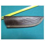 Hand crafted knife with a leather s...