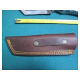 Hand crafted knife with a leather s...