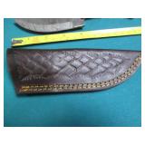 Hand crafted knife with a leather s...