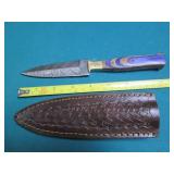 Hand crafted knife with a leather s...