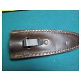 Hand crafted knife with a leather s...