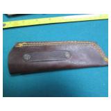 Hand crafted knife with a leather s...