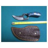 Hand crafted knife with a leather s...
