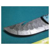 Hand crafted knife with a leather s...