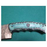 Hand crafted knife with a leather s...
